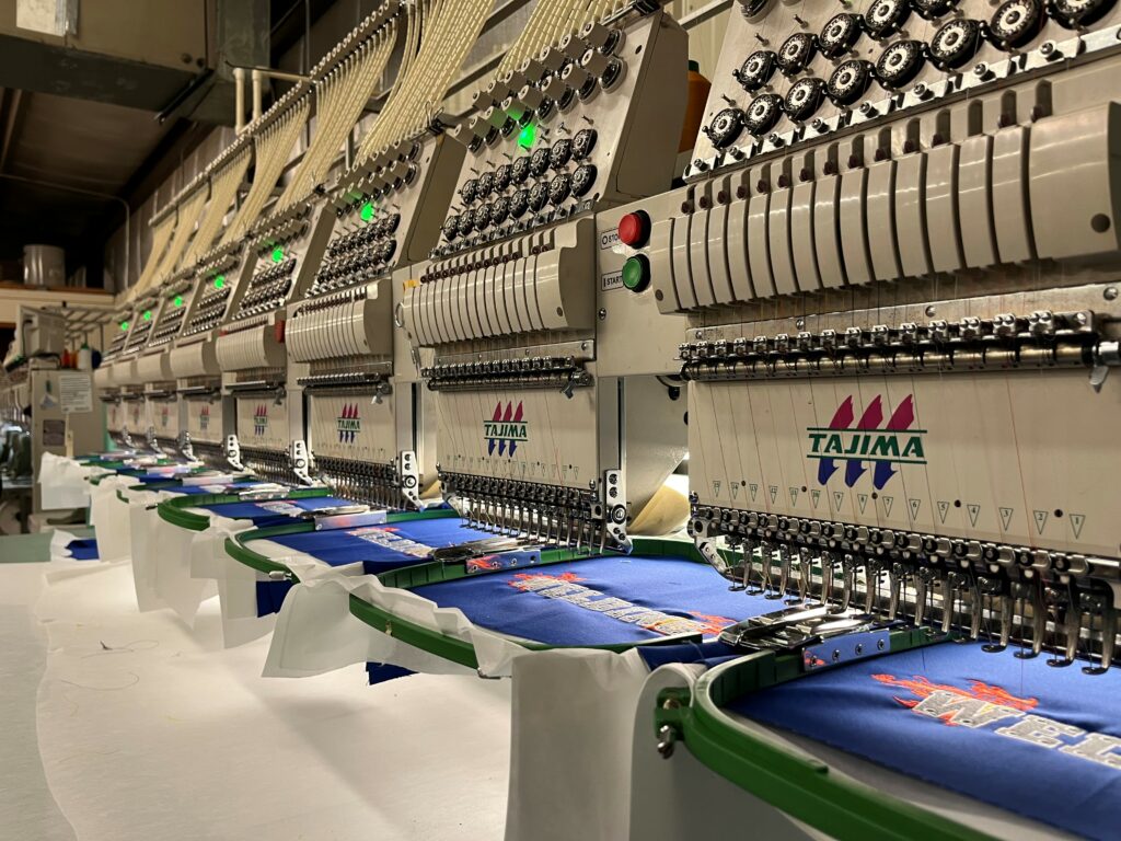 Embroidery Machine adding text to shirts